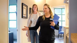 dental hygienist walking patient to her emergency dental appointment at A Glamorous Smile